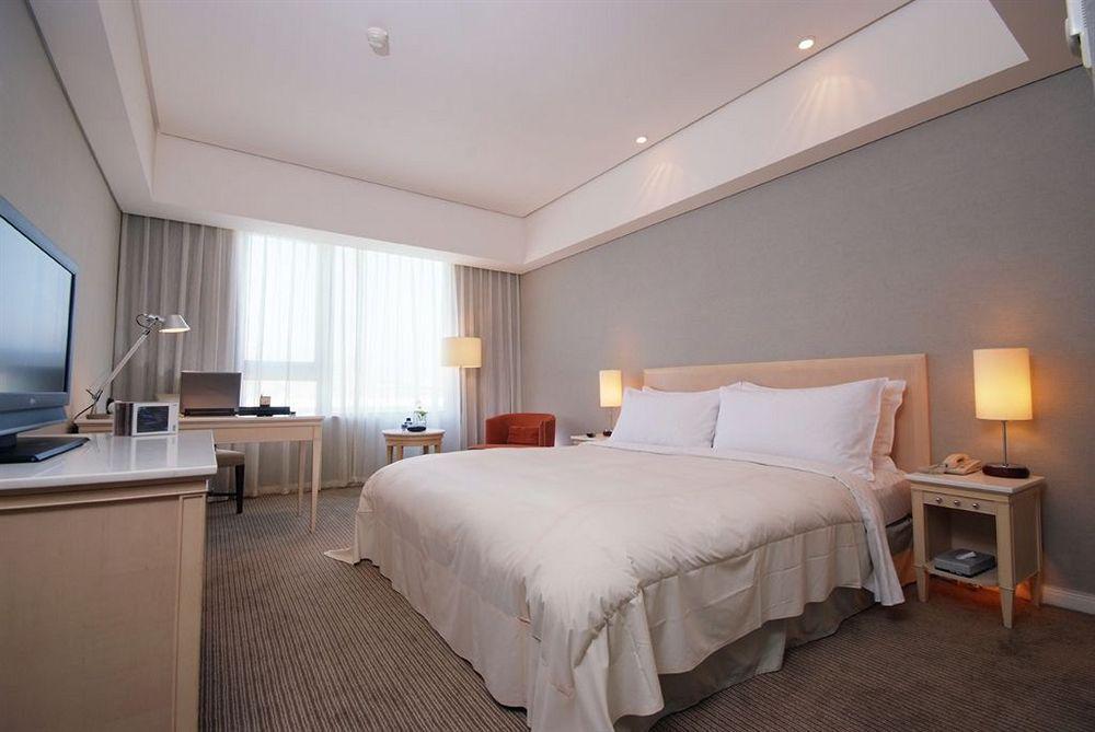Welcome Hotel Taipé Quarto foto